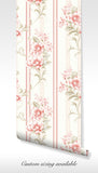 Vintage-inspired wallpaper with delicate floral pattern and stripes in pink and cream tones