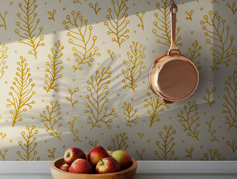 Gold botanical wallpaper with delicate foliage pattern on cream background