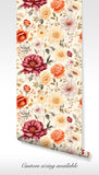 Traditional floral wallpaper in soft red, peach, and cream shades