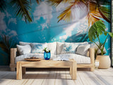 Vibrant tropical wallpaper featuring palm fronds and clouds