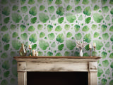 Watercolor monstera leaf pattern in various shades of green for tropical-inspired decor