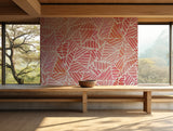 Soft pink and orange palm leaf wallpaper ideal for bohemian-inspired spaces