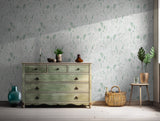 Soft green botanical wallpaper ideal for bedrooms and living spaces