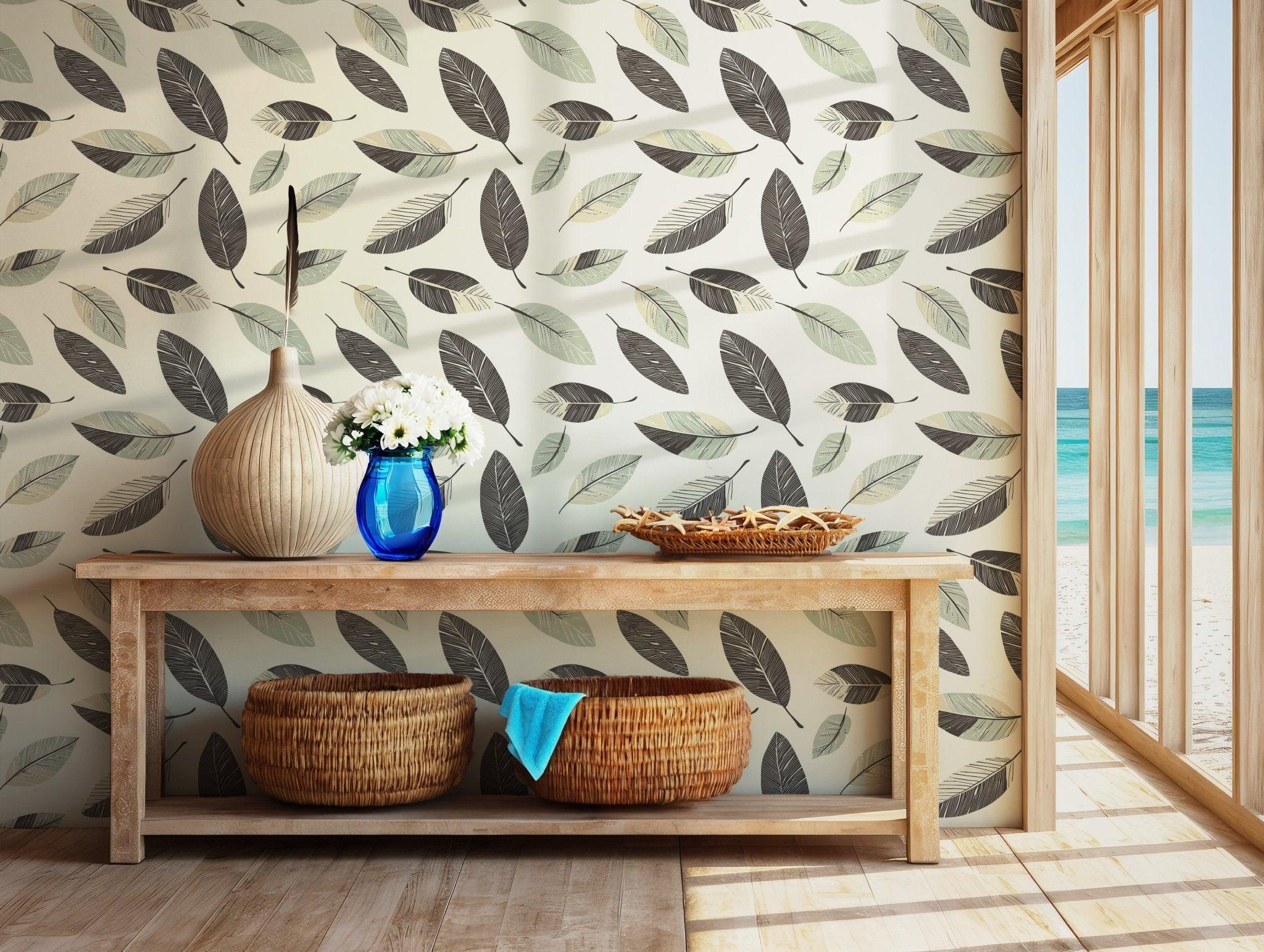 Minimalist green and black leaf print with cream base, printed on removable wallpaper ideal for renters or temporary wall updates.